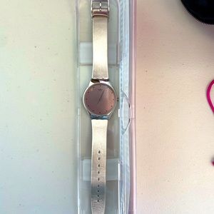 Rose gold Swatch watch